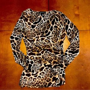 International Concepts/ Cheetah print blouse size/L low cut form fitting